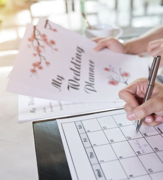 side-view-two-unrecognizable-people-planning-their-wedding-day