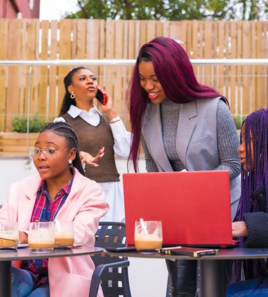 african-american-females-business-meeting-cafeteria-with-laptops-coffee-table